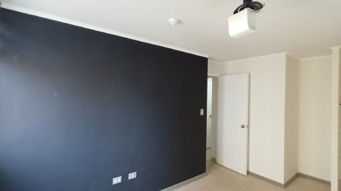 Dormitorio principal con proyector