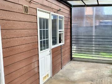 Terraza techada y cerrada