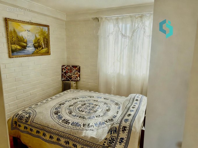 Dormitorio con cómoda