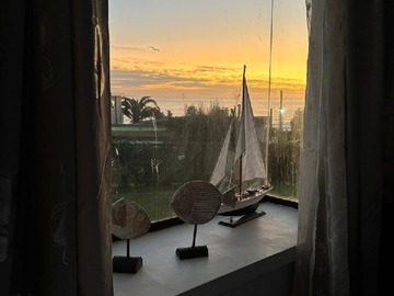 ventana pieza matrimonial atardecer