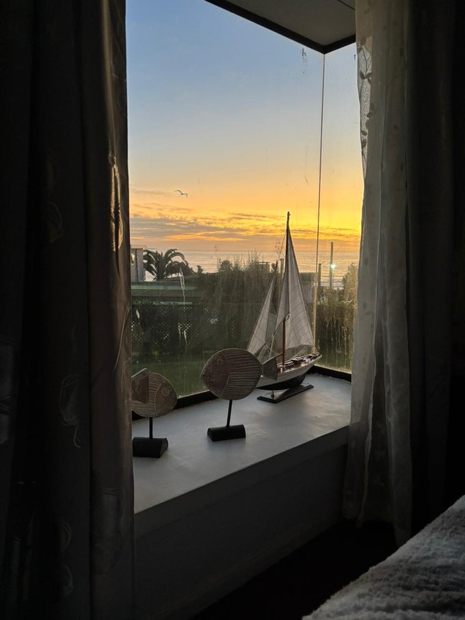 ventana pieza matrimonial atardecer